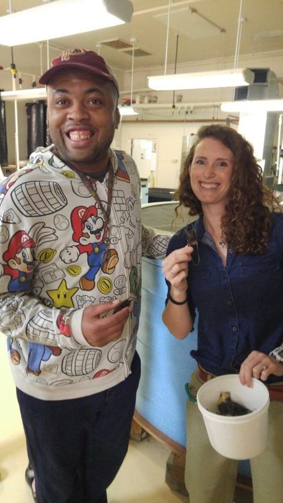 A man and woman posing for a photo in a lab.