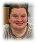 Portrait of smiling woman in gray shirt